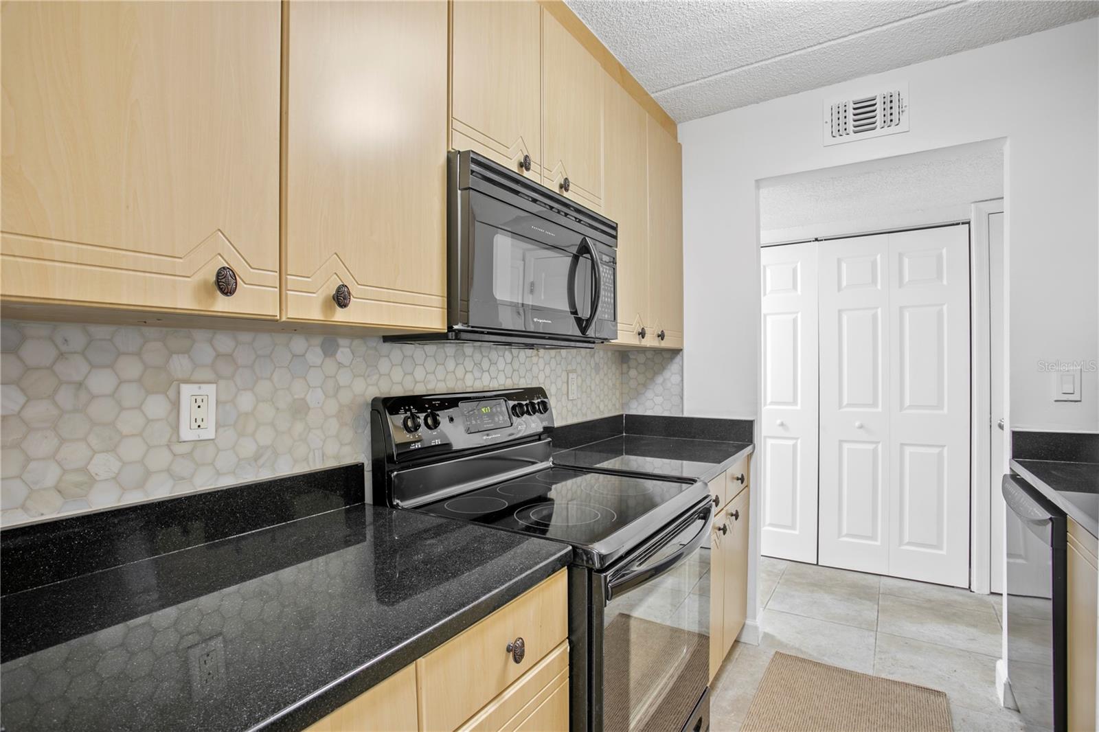 Loads of storage in the cabinets PLUS a hallway pantry