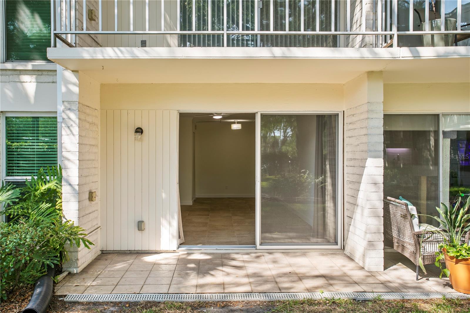 Covered patio for outdoor dining or simply relaxing and enjoying the courtyard.