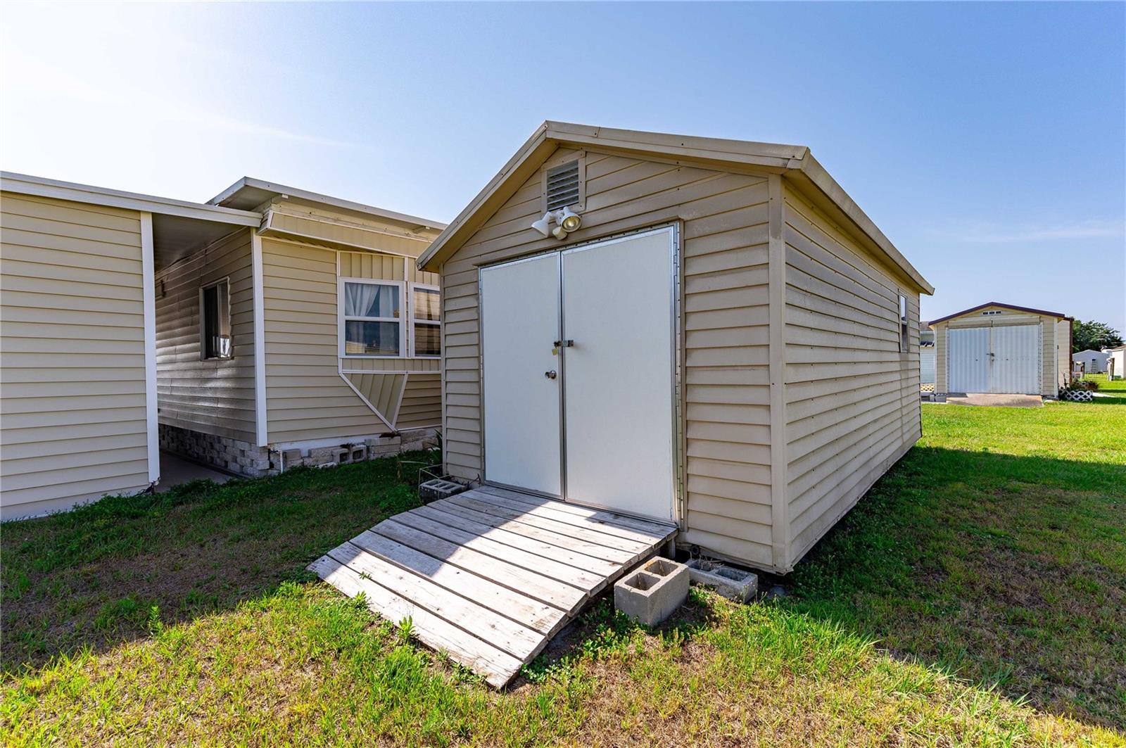 Large storage shed in backyard.