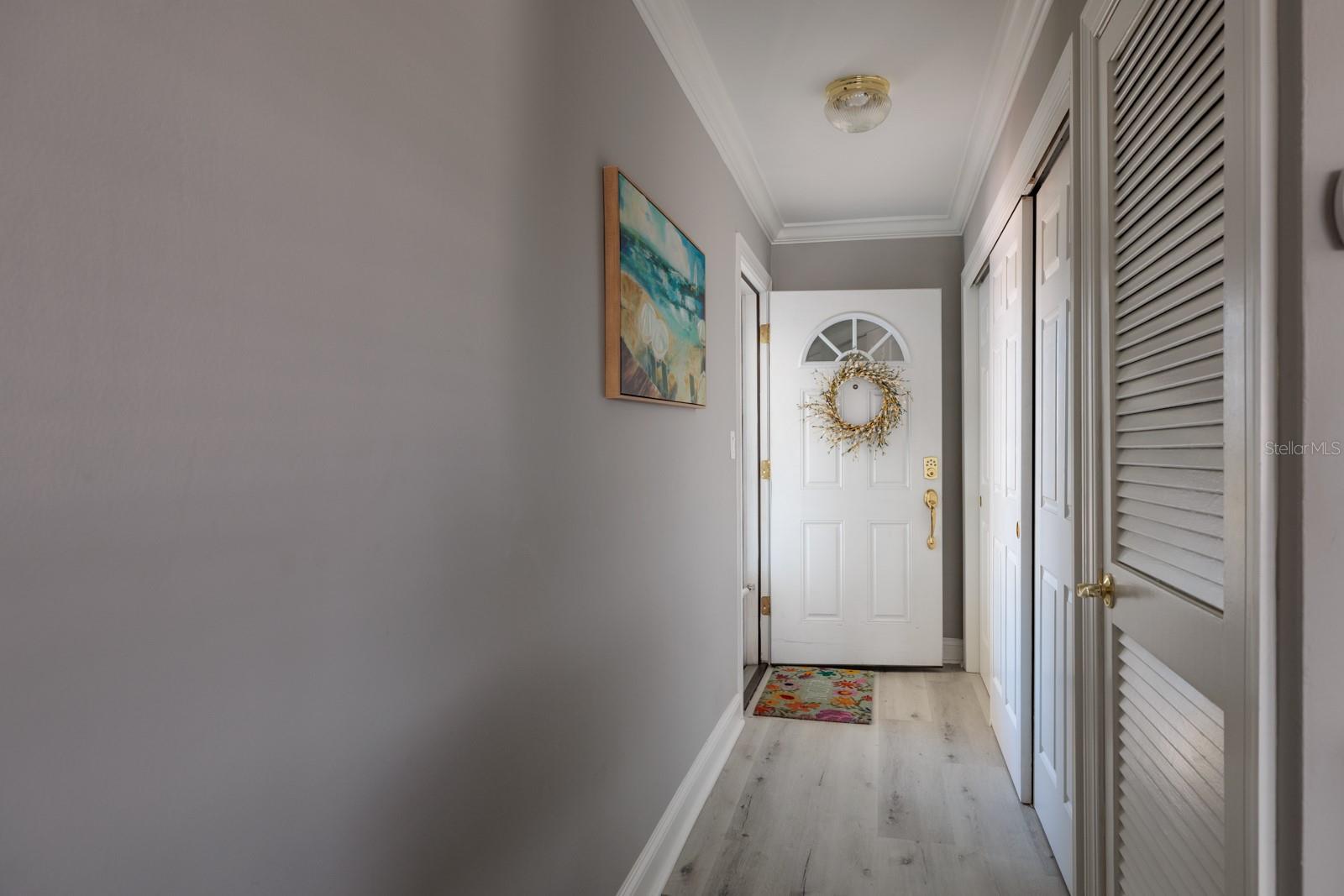 Foyer w/large storage closet & A/C-water heater closet. Metal front door.