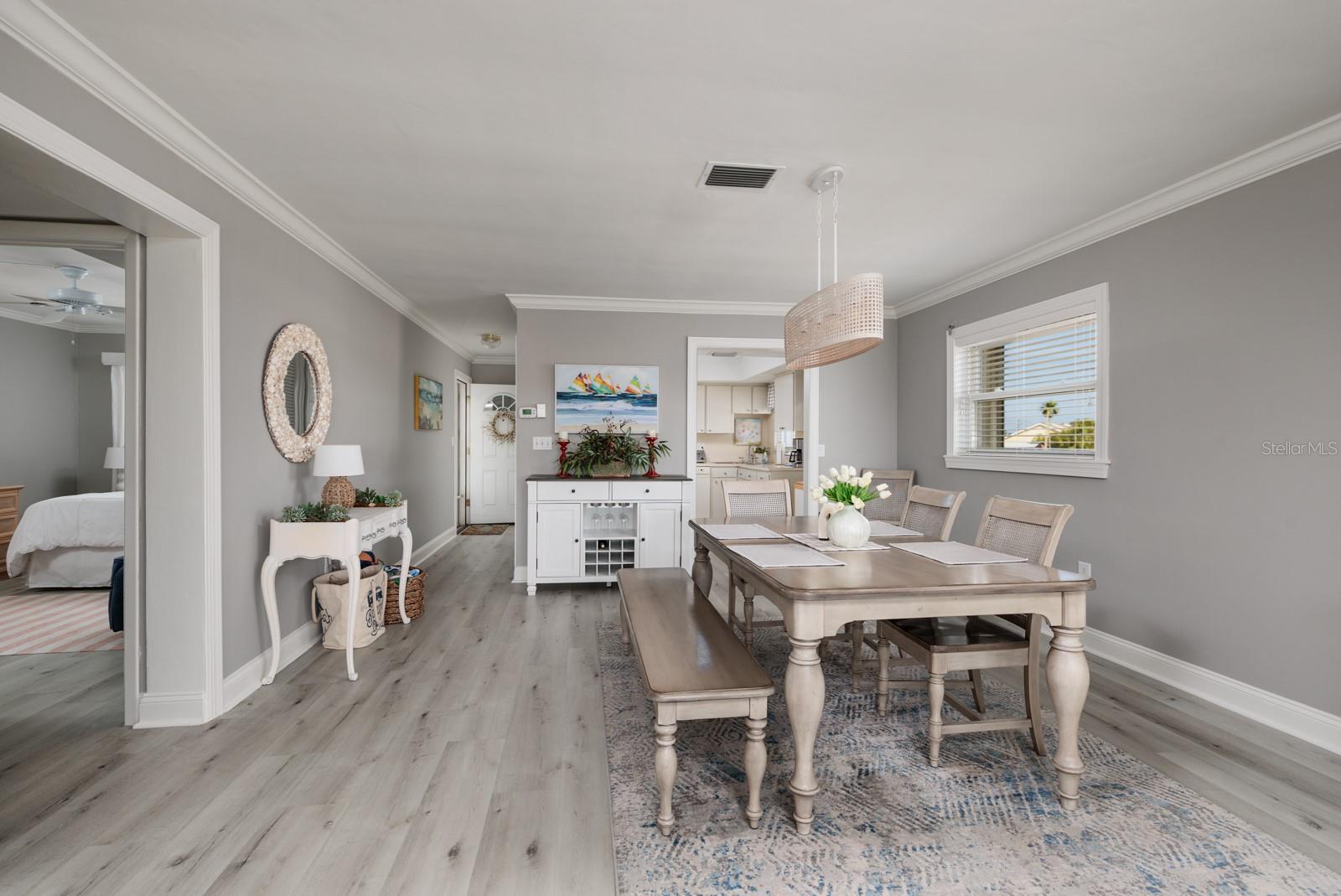 Dining area w/Crown Moldings. Doorway to kitchen.