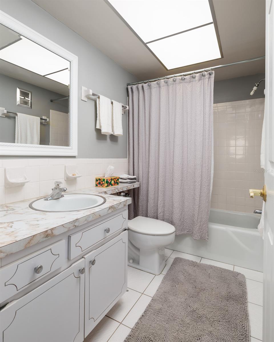 Primary bathroom w/linen closet.