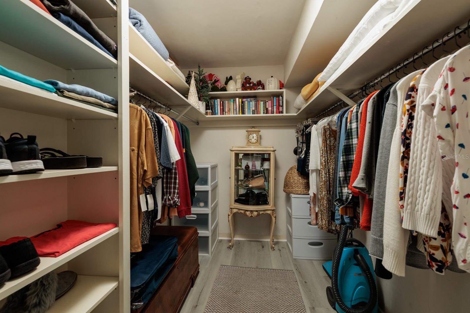 Walk-in closet, primary bedroom.