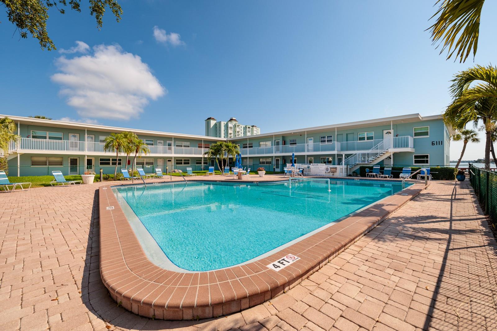 South pool (not heated) by the pier. Grilling area next to pool.