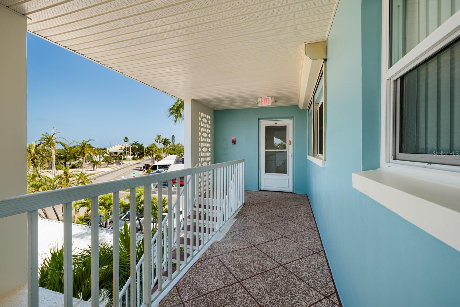 Front door & Hurricane Shutter over 2nd bedroom window.