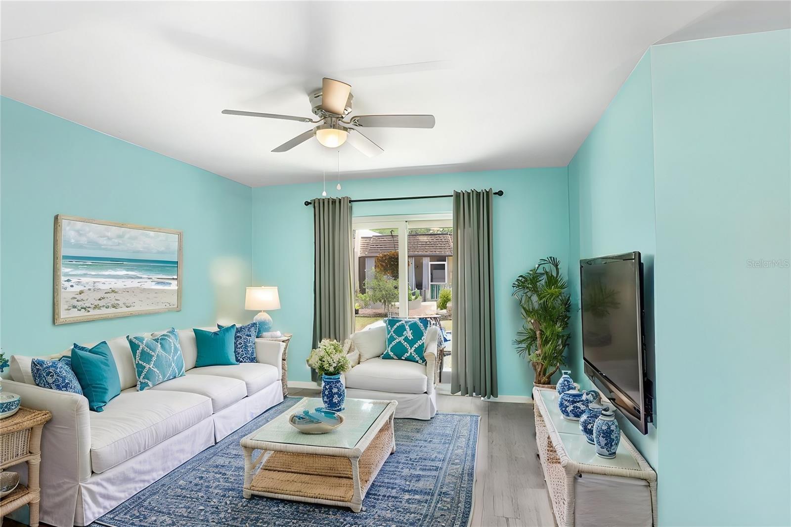 Living room opens to covered patio