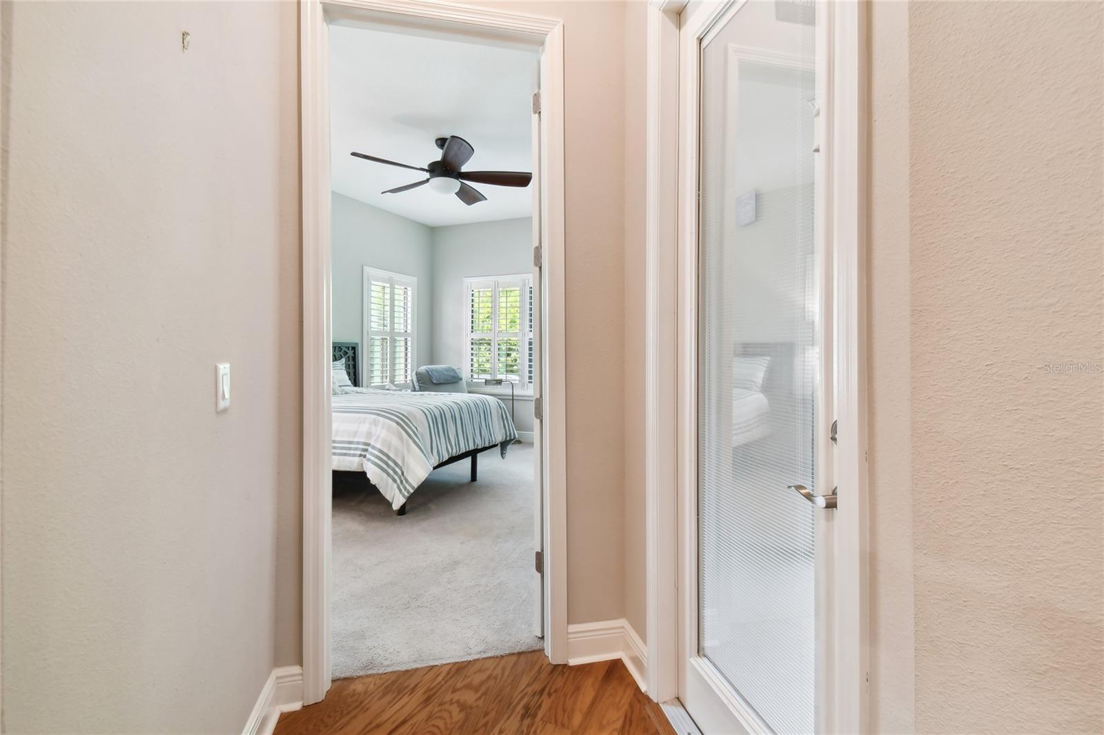 Right off Living area is the downstairs Owner's suite.  Door to the left goes out to the screened lanai.