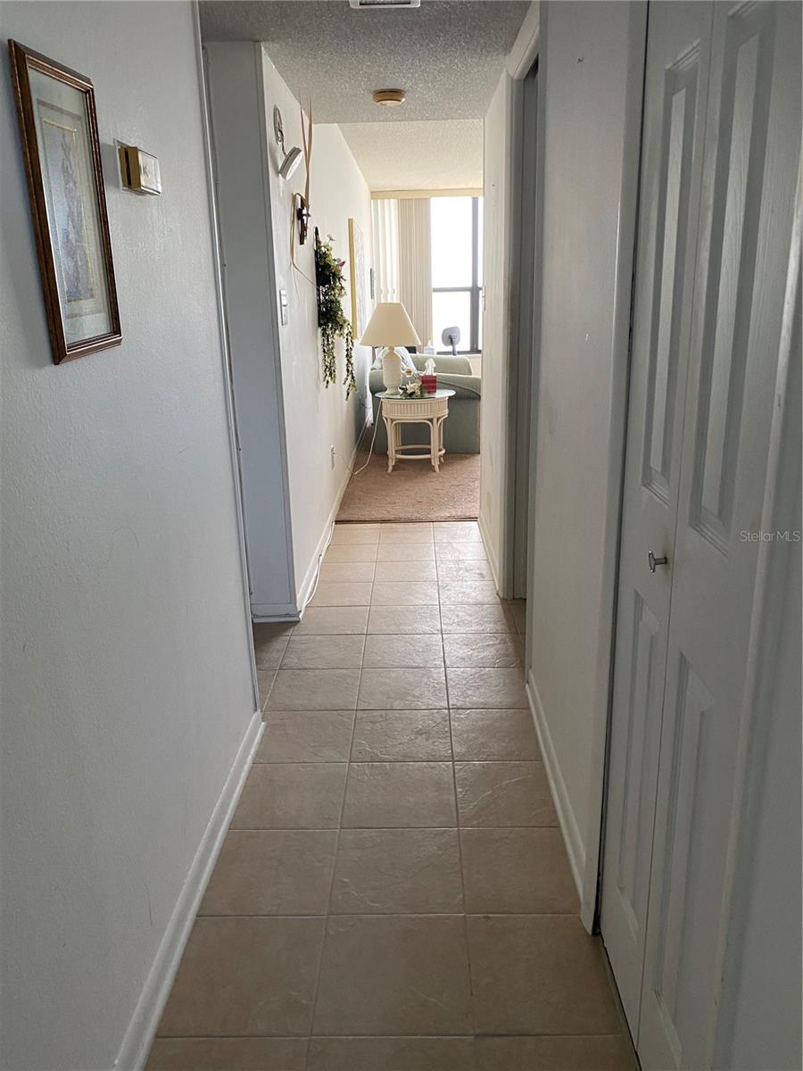 HALLWAY WITH TILE FLOOR