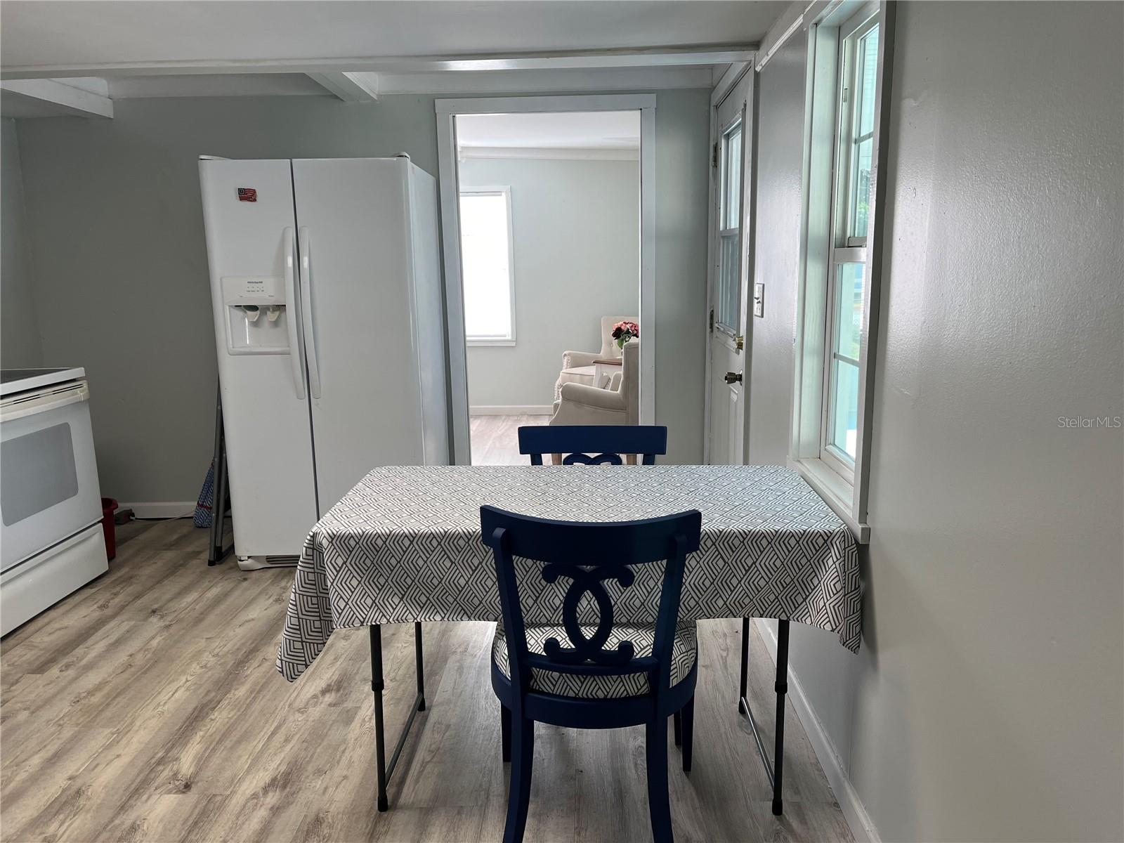 Kitchen showing refrigerator.  There is ample room to have a larger table if desired