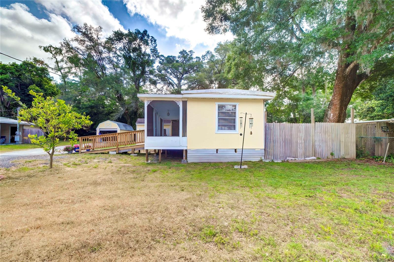 Side view of the house.  Notice the side yard is partially fenced in for privacy