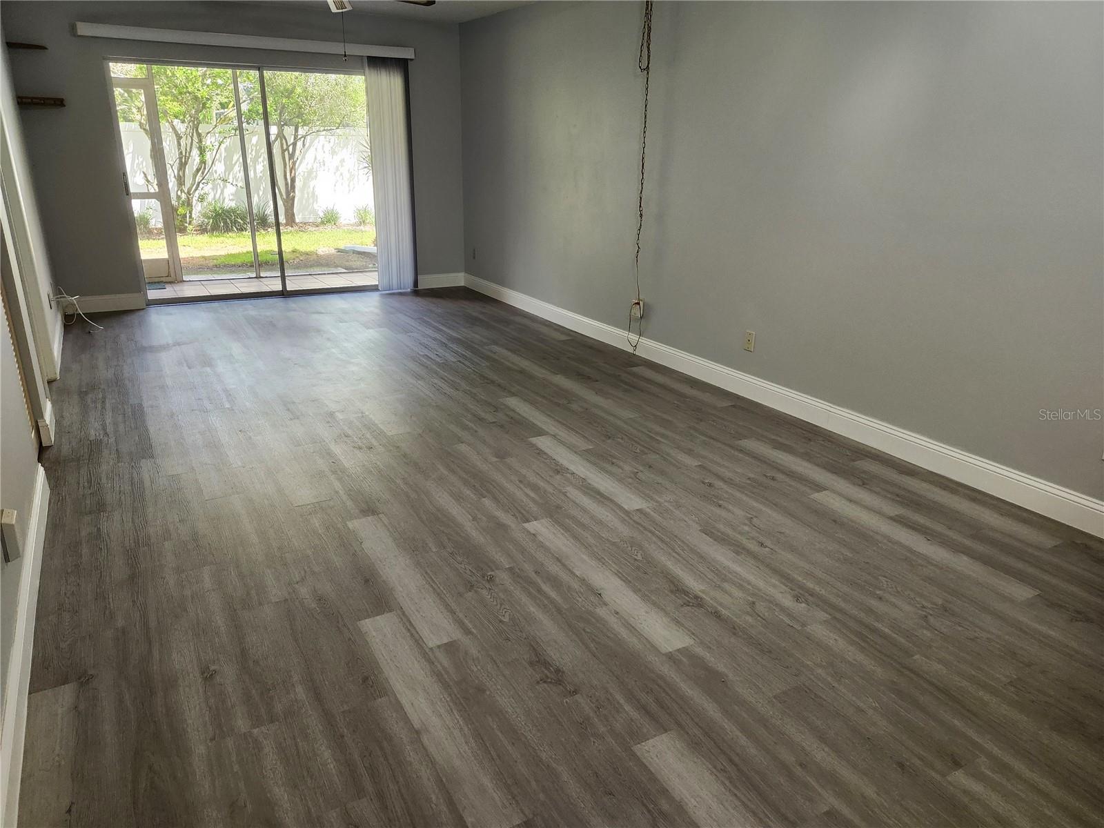 Living Room With Sliders to Screened Porch