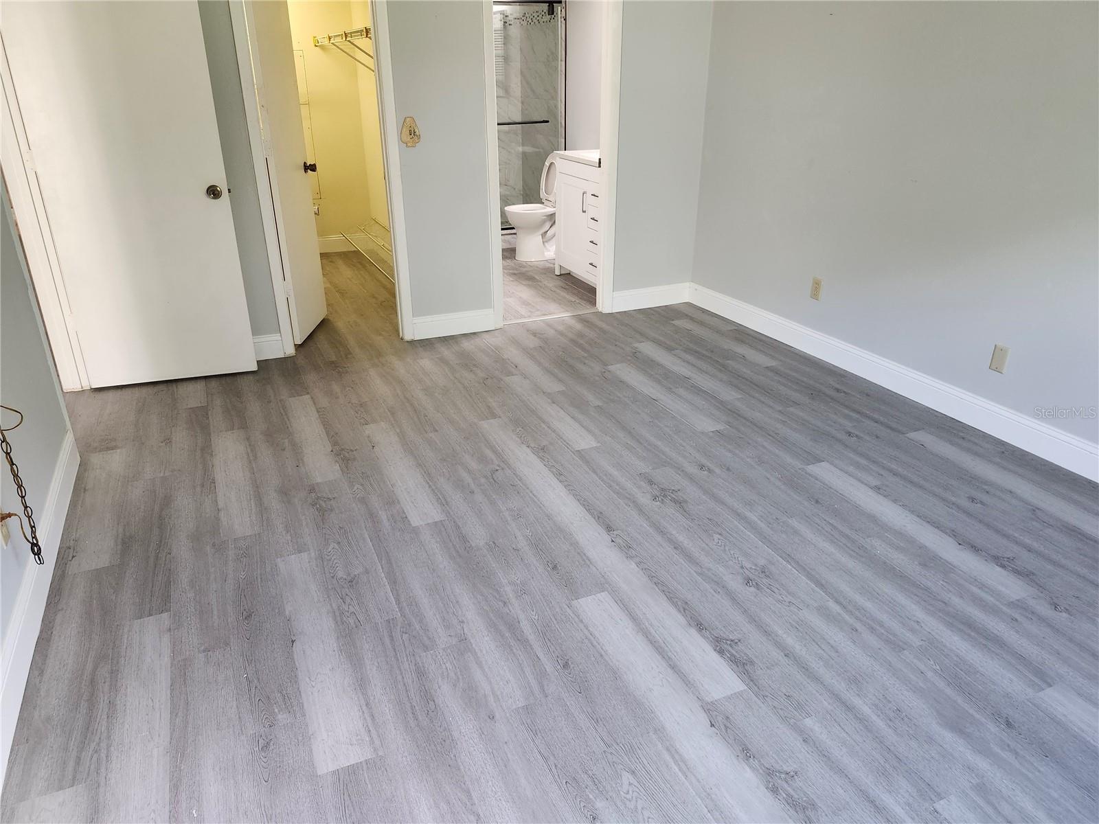 Primary Bedroom has Sliders to Screened Porch