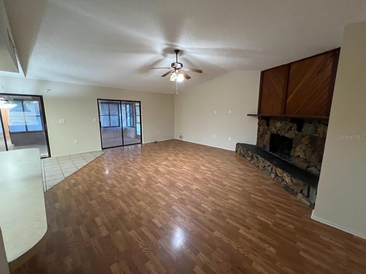 family room w/ wood burning fireplace