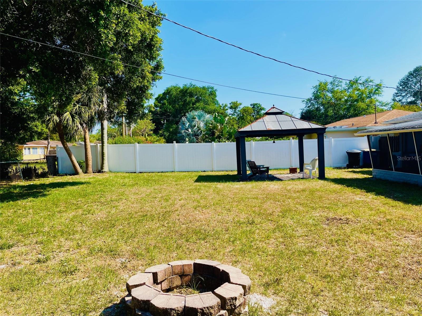 Backyard with fire pit, view from north side