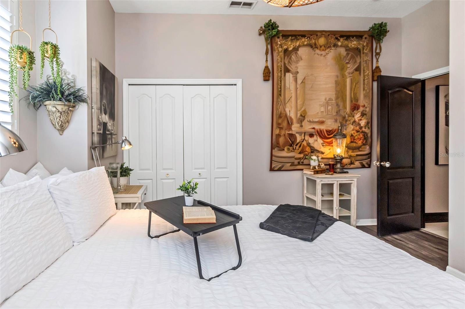 View of bedroom that shows entrance into the adjoining hallway