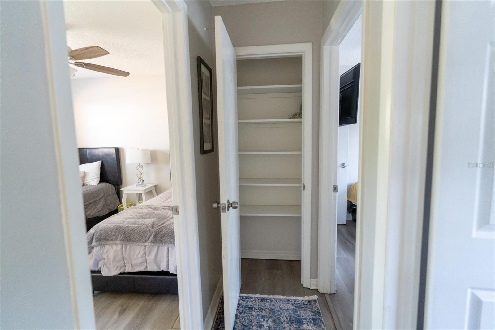 Hallway Closet, to Primary Bedroom on left