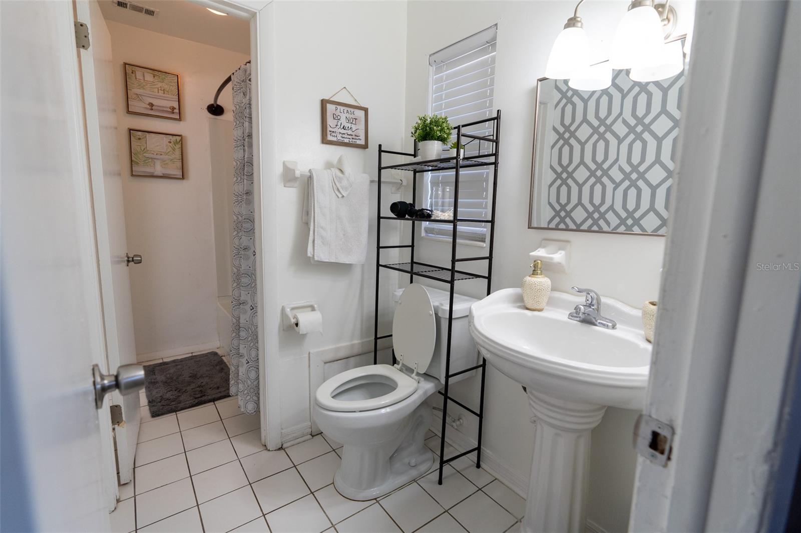 En-Suite Primary Bathroom entrance w/door leading to full bath and shower