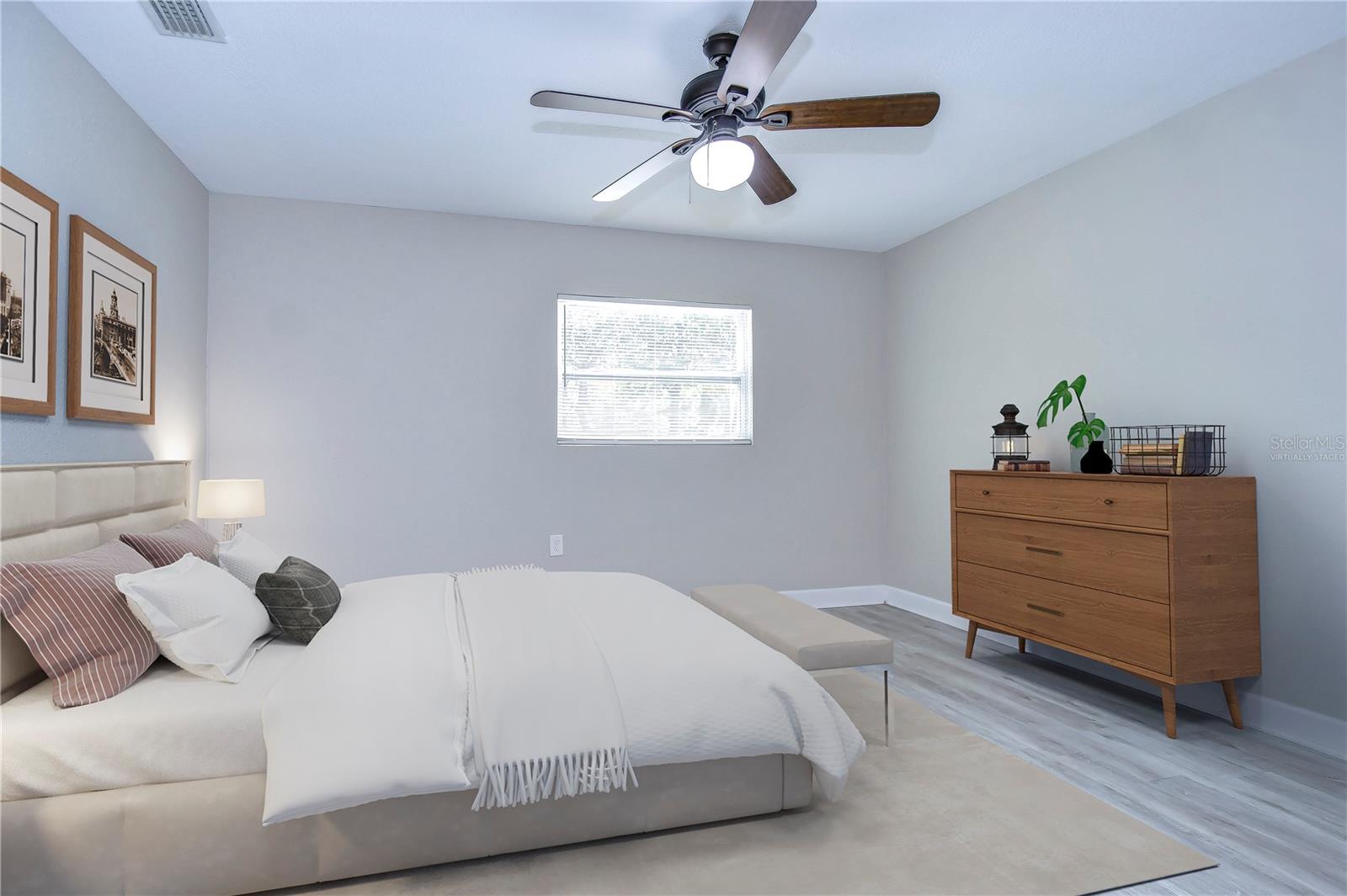 Virtually staged photo; primary bedroom with walk-in closet and ensuite bathroom