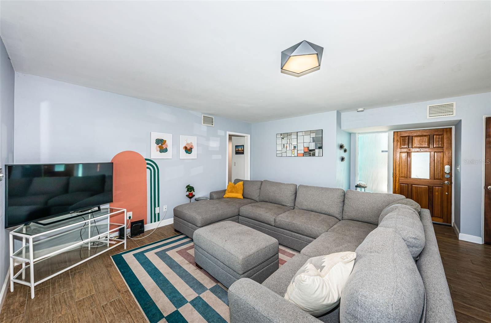 Living room with wood look tile flooring