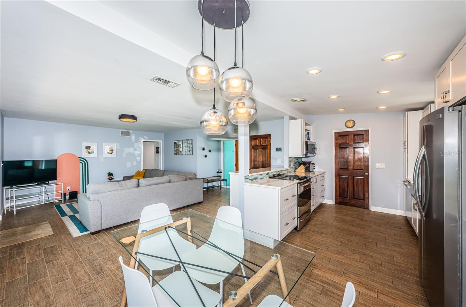 Open floor plan showing kitchen, dining and living