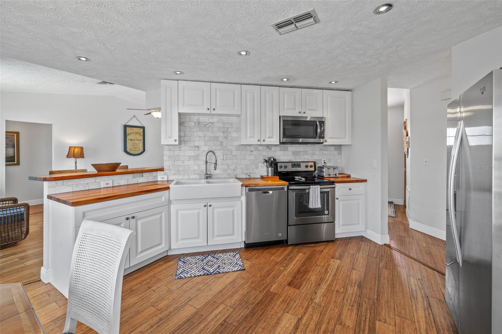 Remodeled kitchen with butcher block countertops.