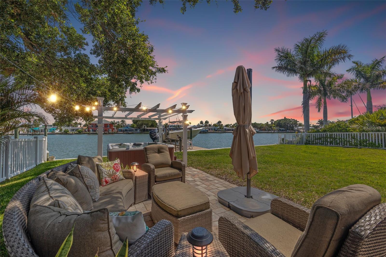 Vacation every day with these intracoastal water views and beautiful backyard