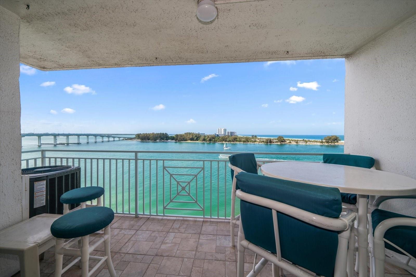 Balcony with table, chairs and stools