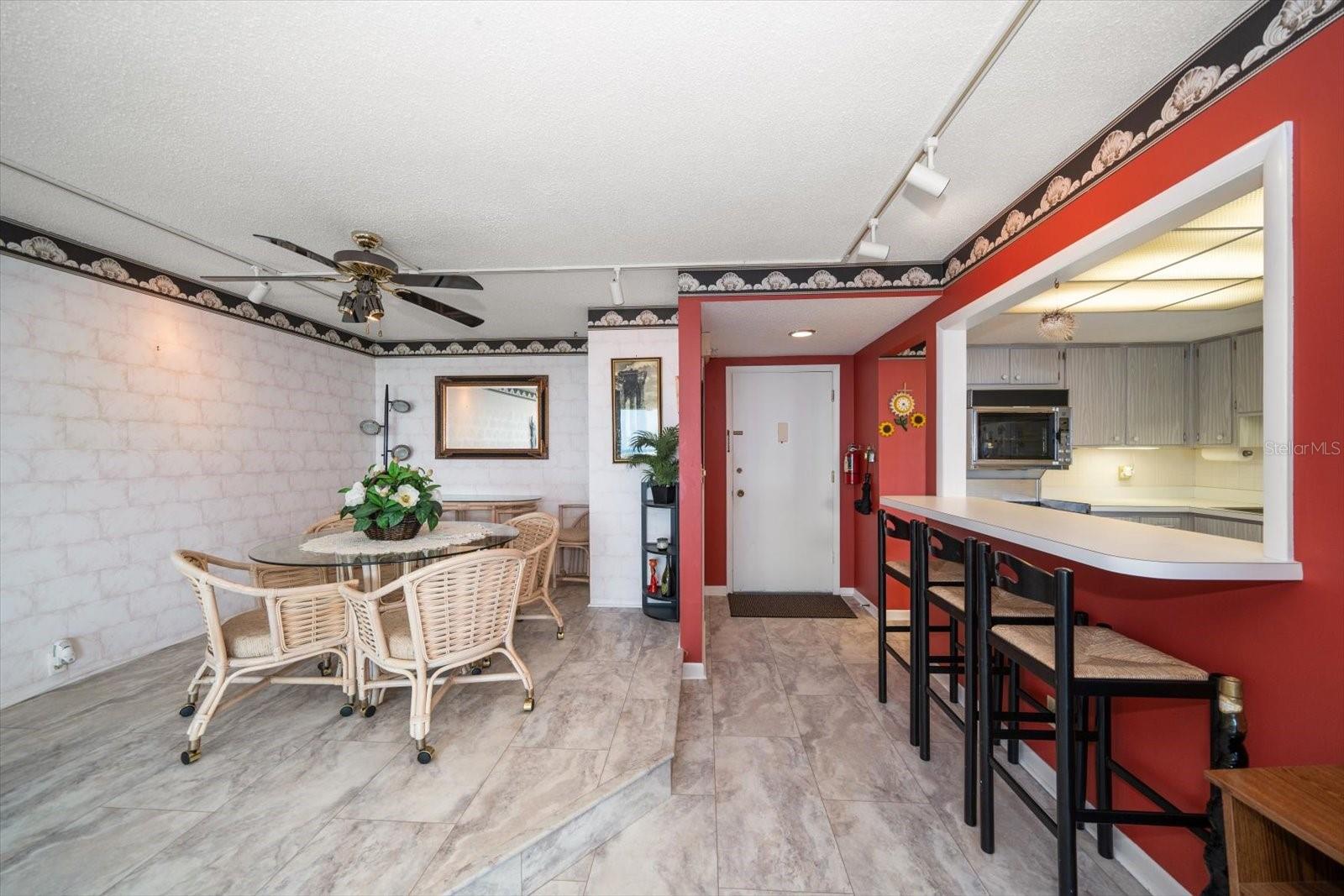 Raised dining room and eating space at kitchen pass-through counter