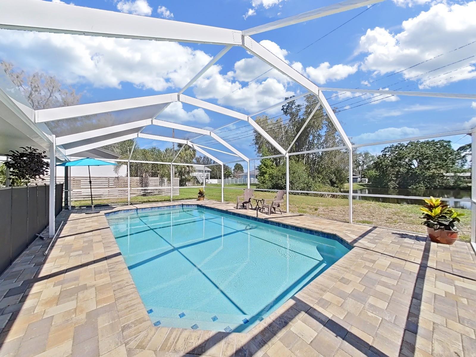 The enclosed inground pool, measuring 14X28, has 3 entry steps and a 4 foot bench. Higher grade screening for the enclosure and the porch so no worries about bugs while enjoying this area.