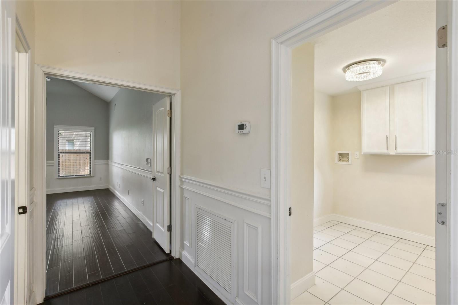 HALLWAY/ ENTRANCE TO MASTER AND VIEW OF LAUNDRY ROOM