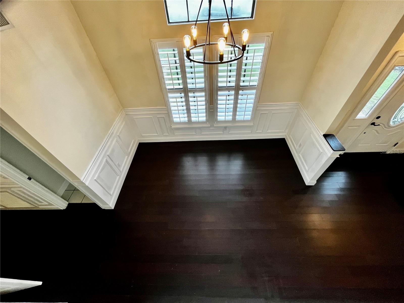 VIEW OF DOWNSTAIRS FAMILY ROOM FROM 2ND LEVEL