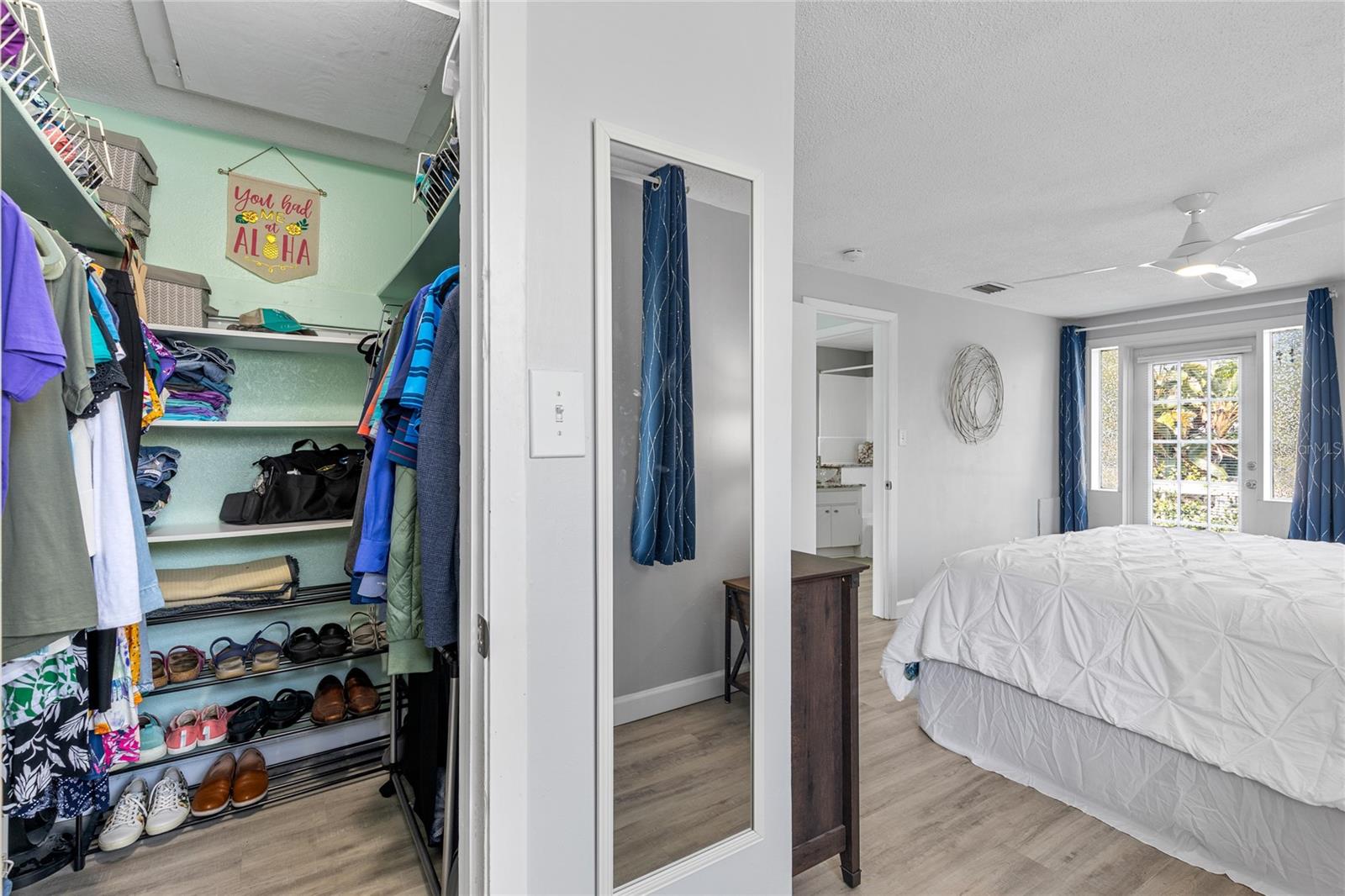 The Primary bedroom is ample sized with large windows and beautiful Luxury Vinyl floors.