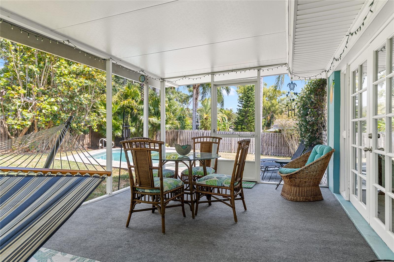 Screened Lanai overlooking the back yard and pool.