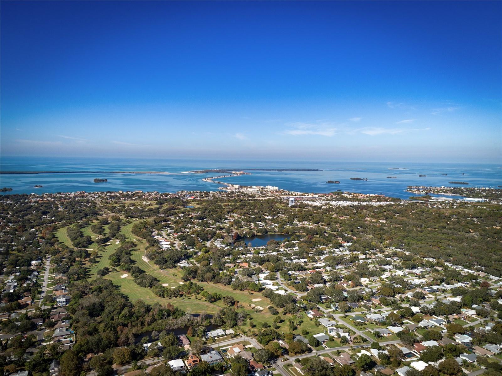 This aerial view shows the front 9 of the Dunedin Golf Club looking WEST toward the Gulf of Mexico.  This photo was before the renovation started.   The Golf course is currently going thru a nearly 6 million dollar restoration and is expected to reopen this Fall.