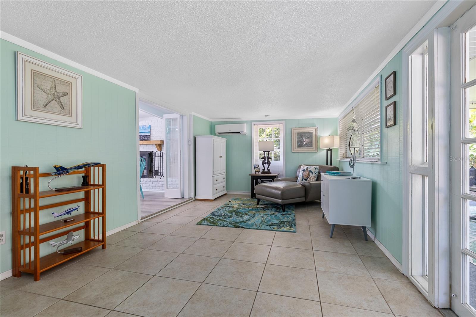 Alternate view in the Florida Room.  You will love the Easy care tile floors and it's own newer Mini Split AC system.