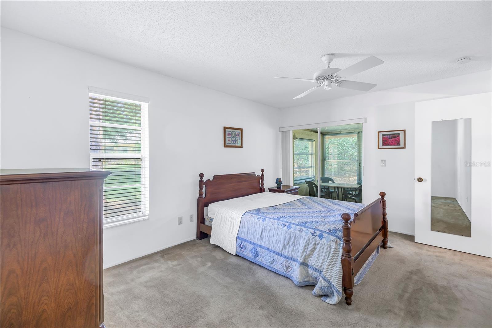 Primary Bedroom With Sliding Doors To Porch