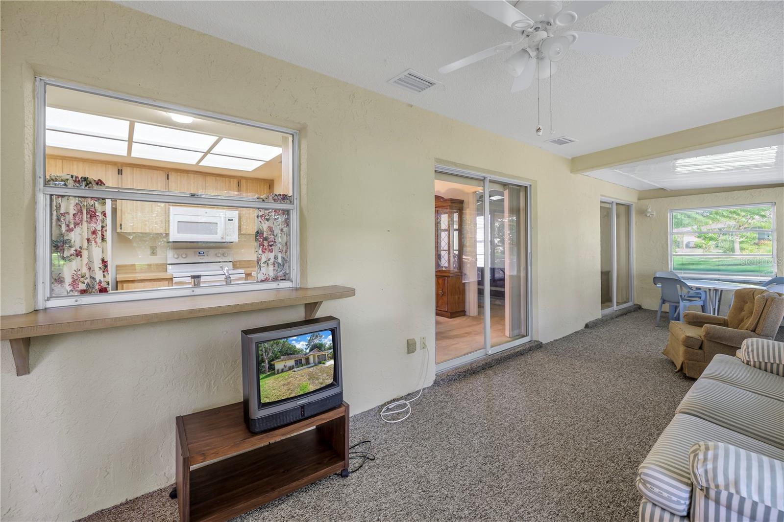 Enclosed Porch With Pass Through To Kitchen