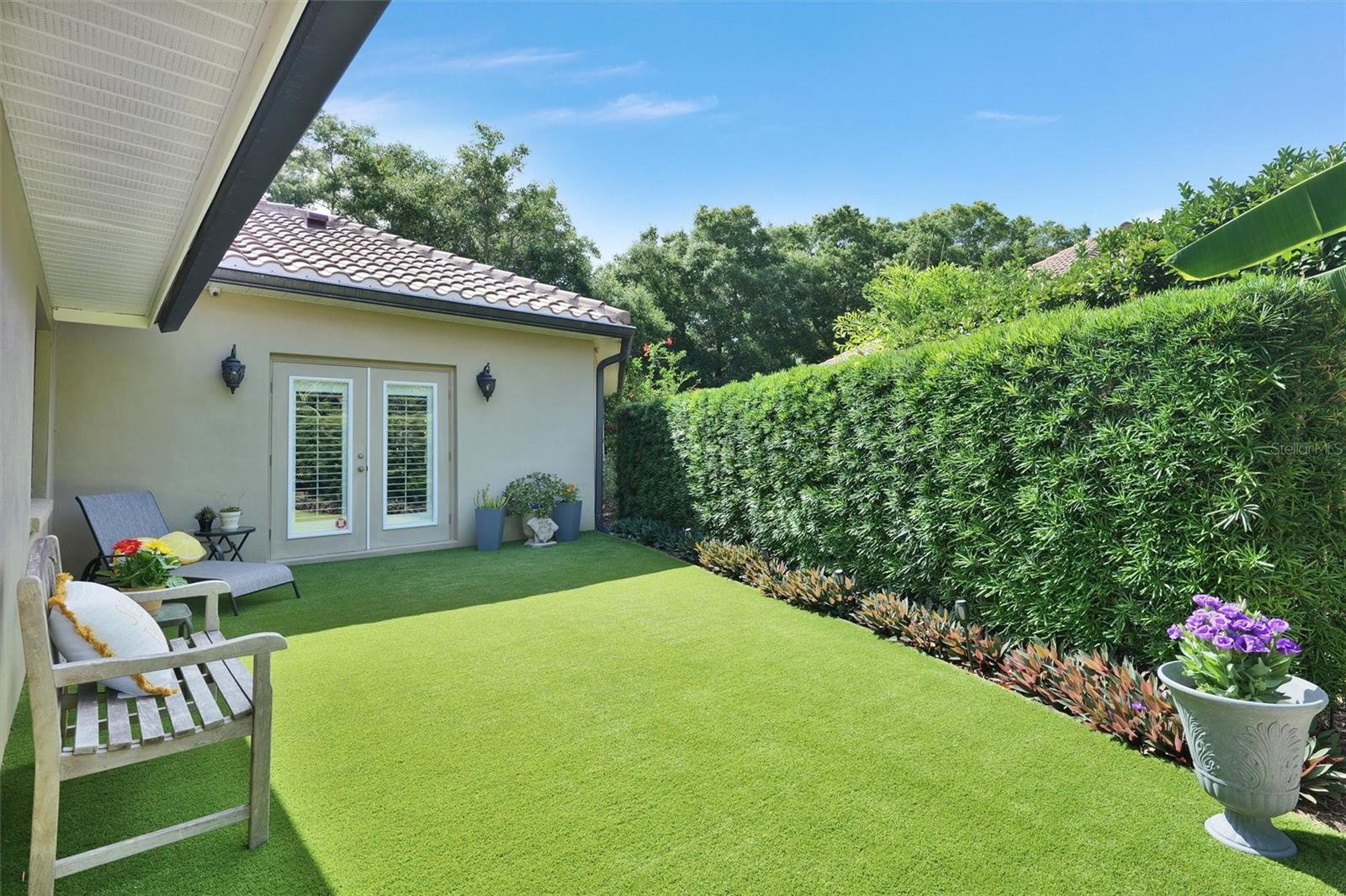 Artificial turf, sit and enjoy a book out in the sun.