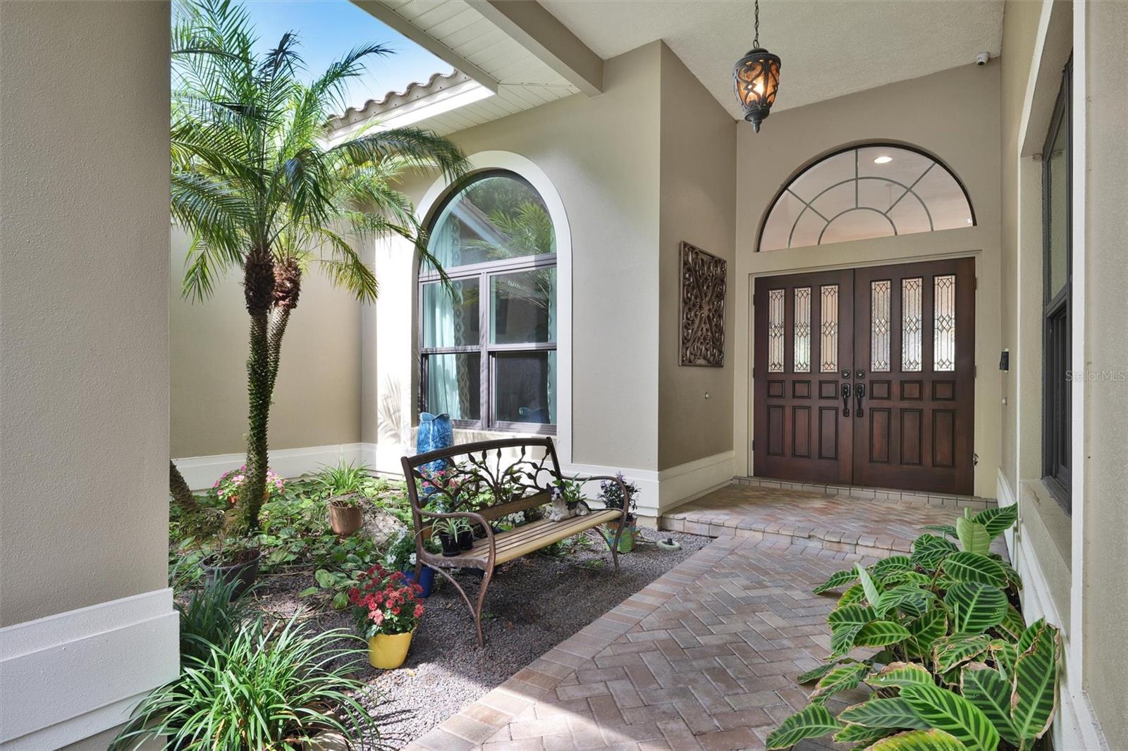 Beautiful entrance to the home with brick pavers