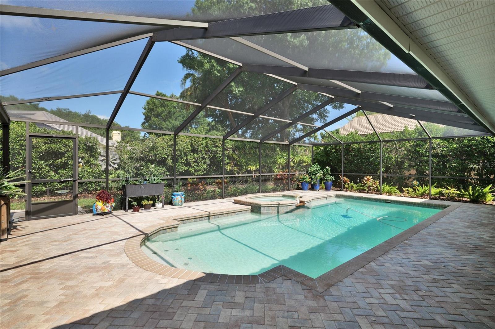 Pool deck has pavers, spa.