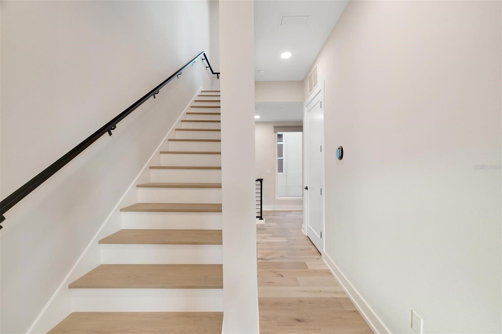 Staircase ascending to the fourth floor.