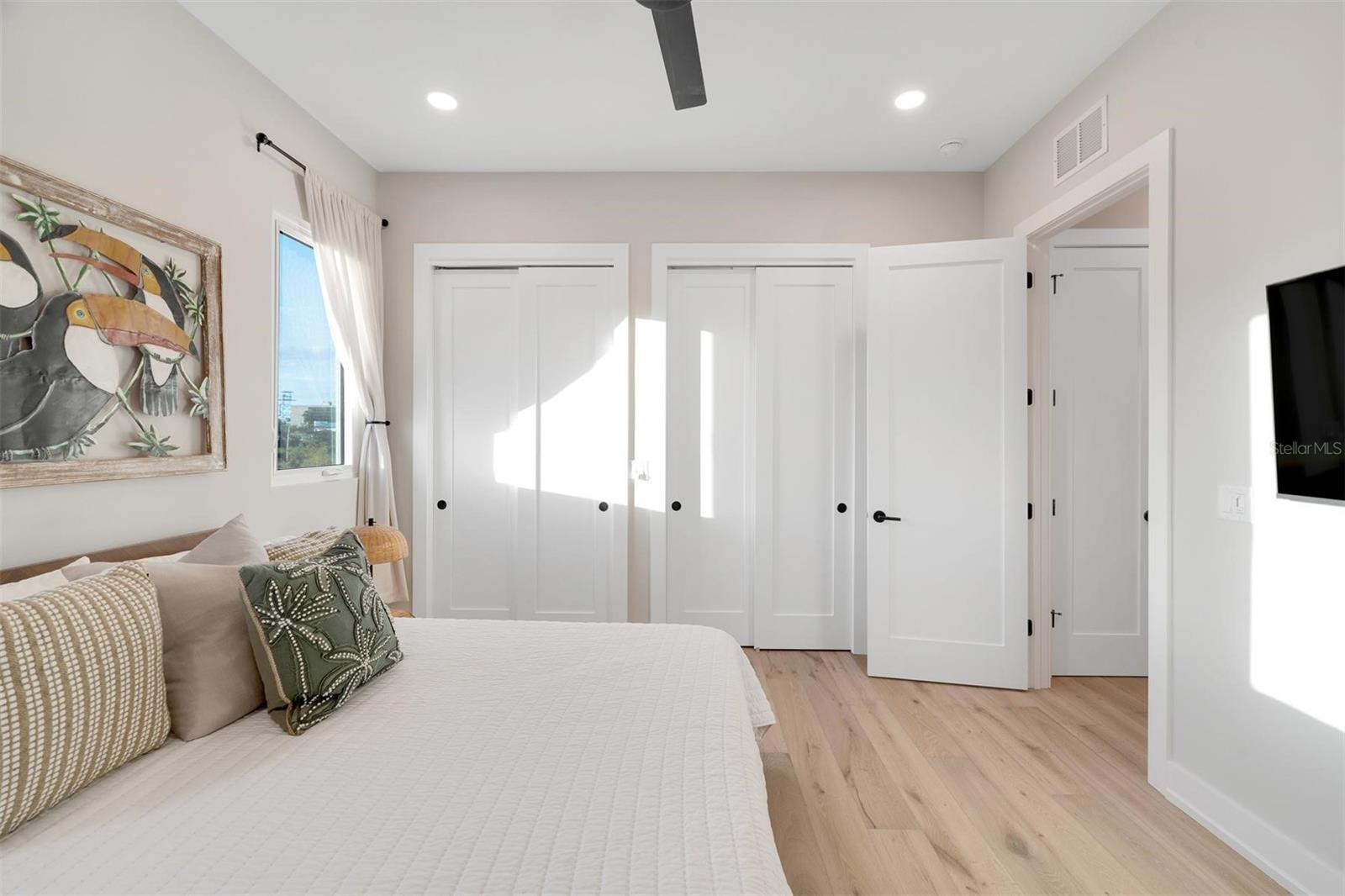 Guest bedroom featuring closet system.