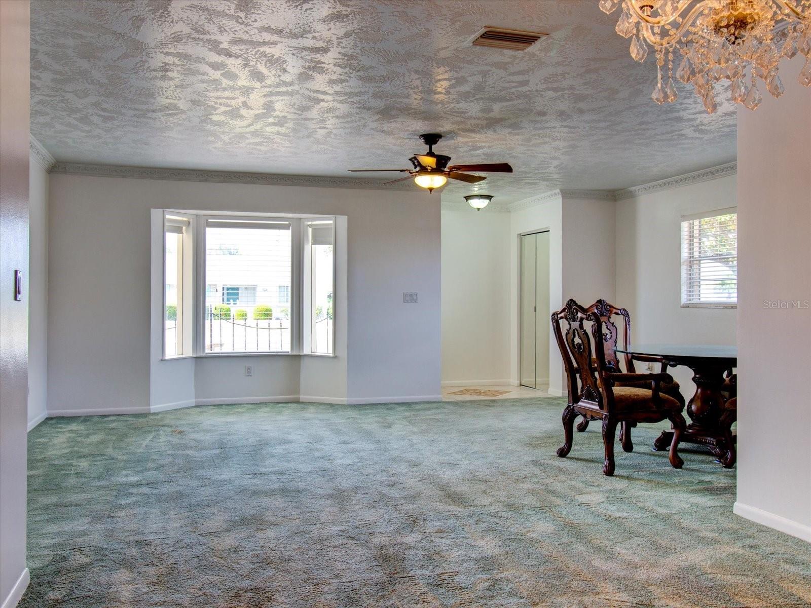 Living Room at entry with Large Bay Window looking toward the front