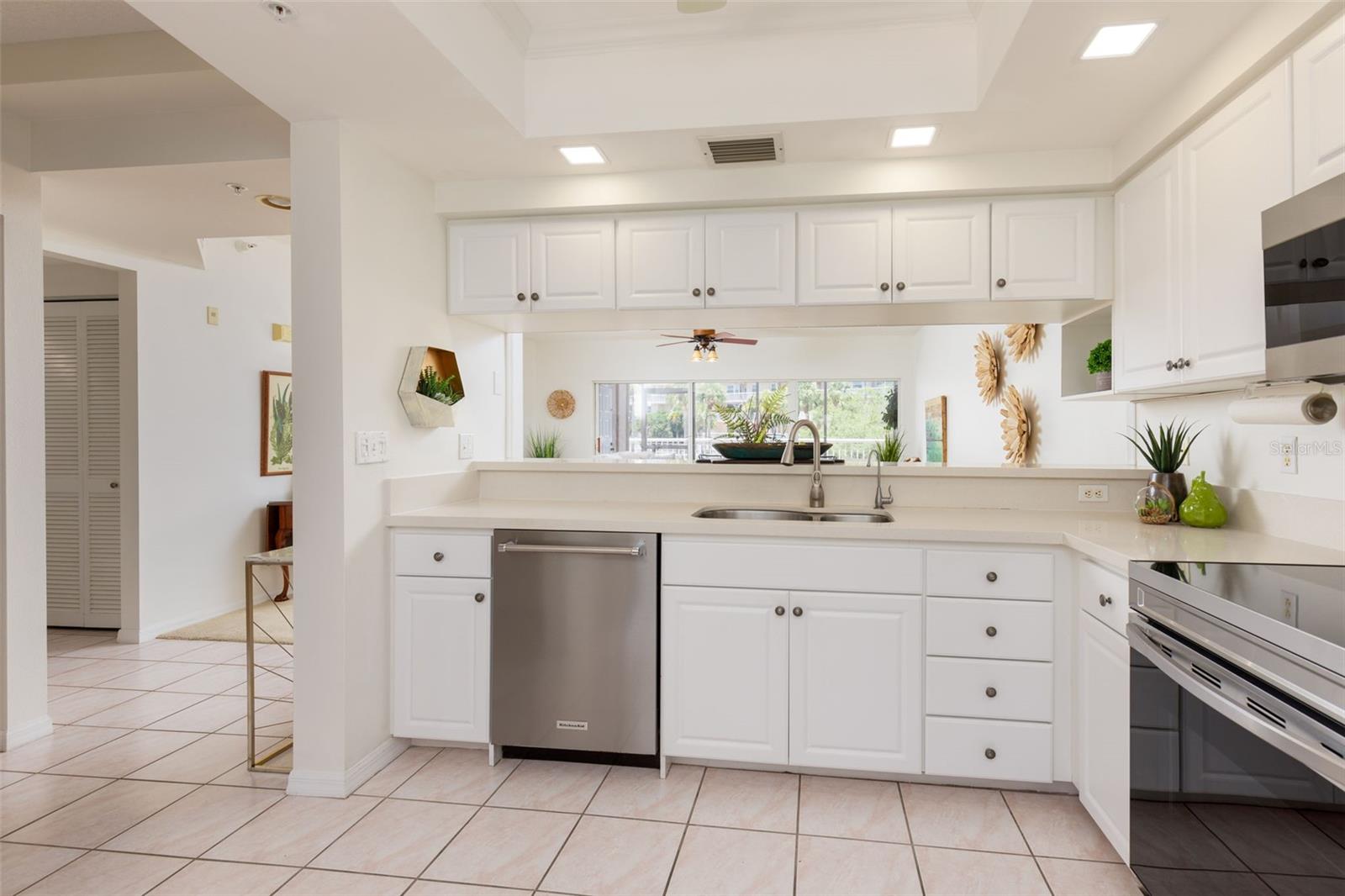 Kitchen looking out into Dining and Living Area