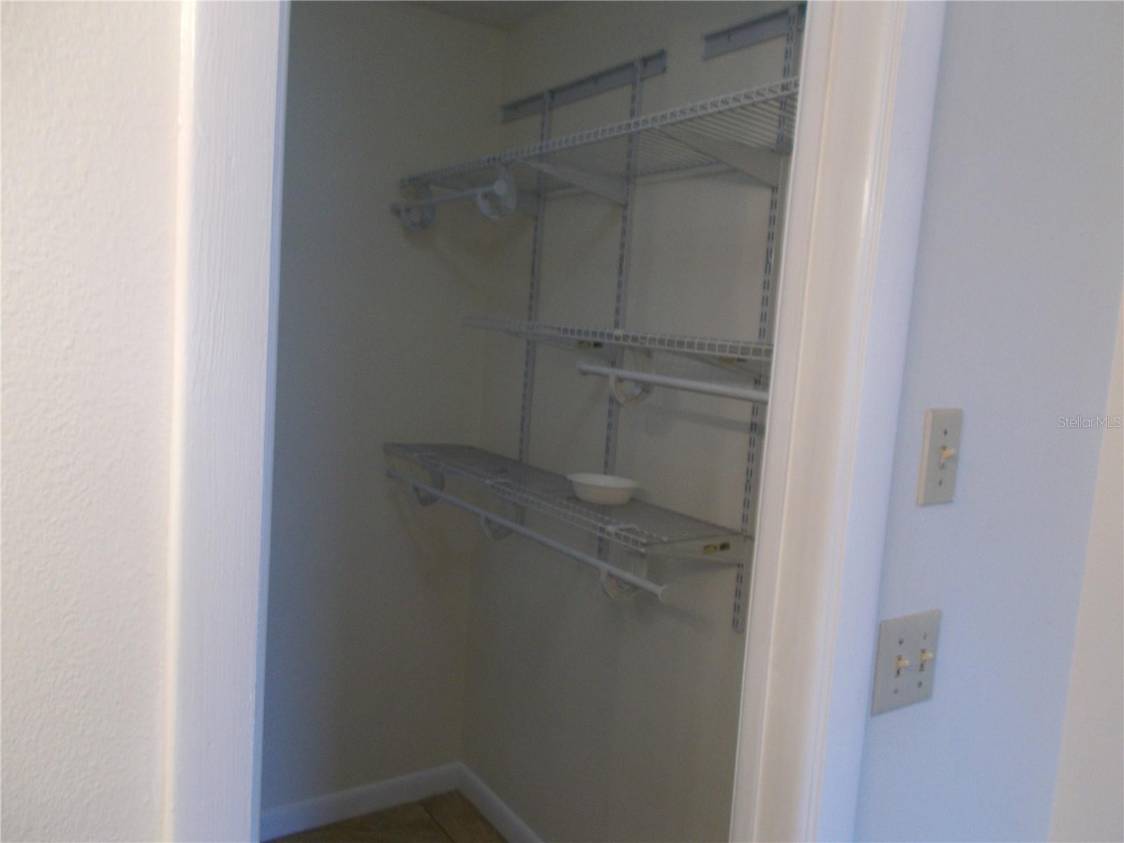 Right side view of the walk-in closet.