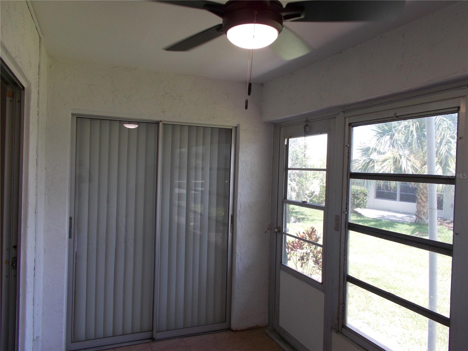 The lanai showing the sliding glass doors that lead to the Master Bedroom.