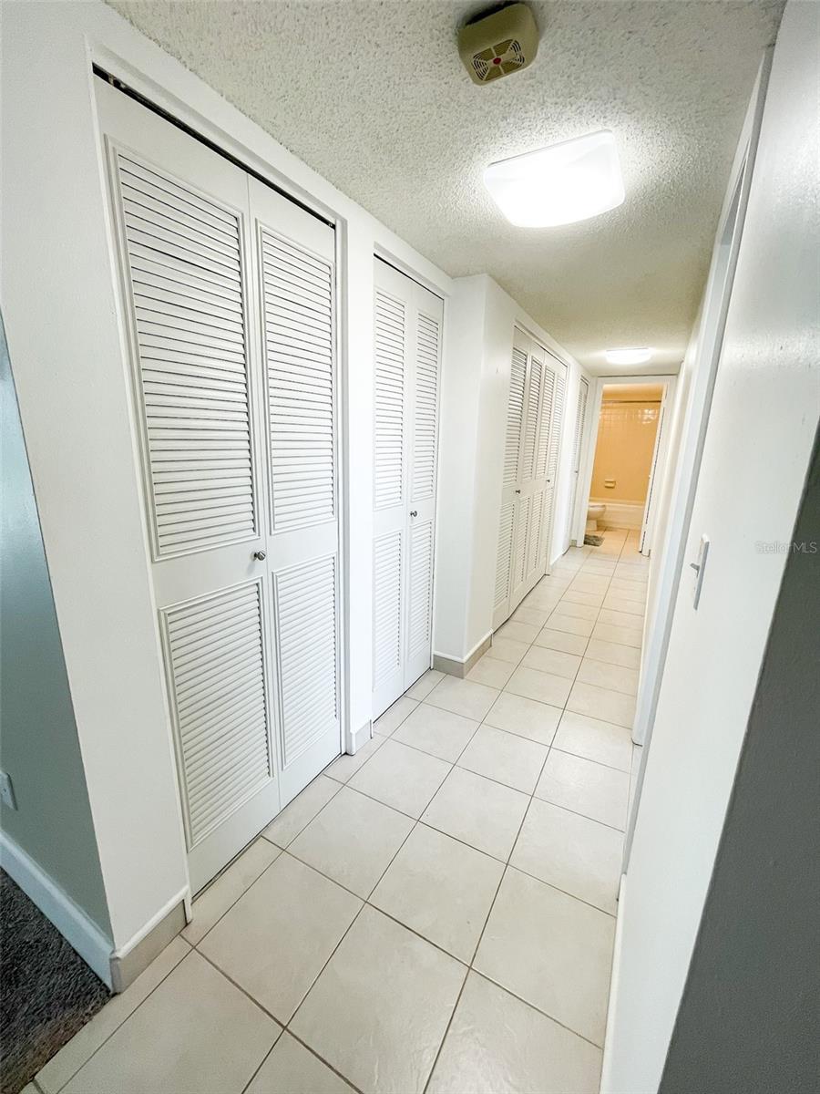 Hallway has 3 closets for storage.