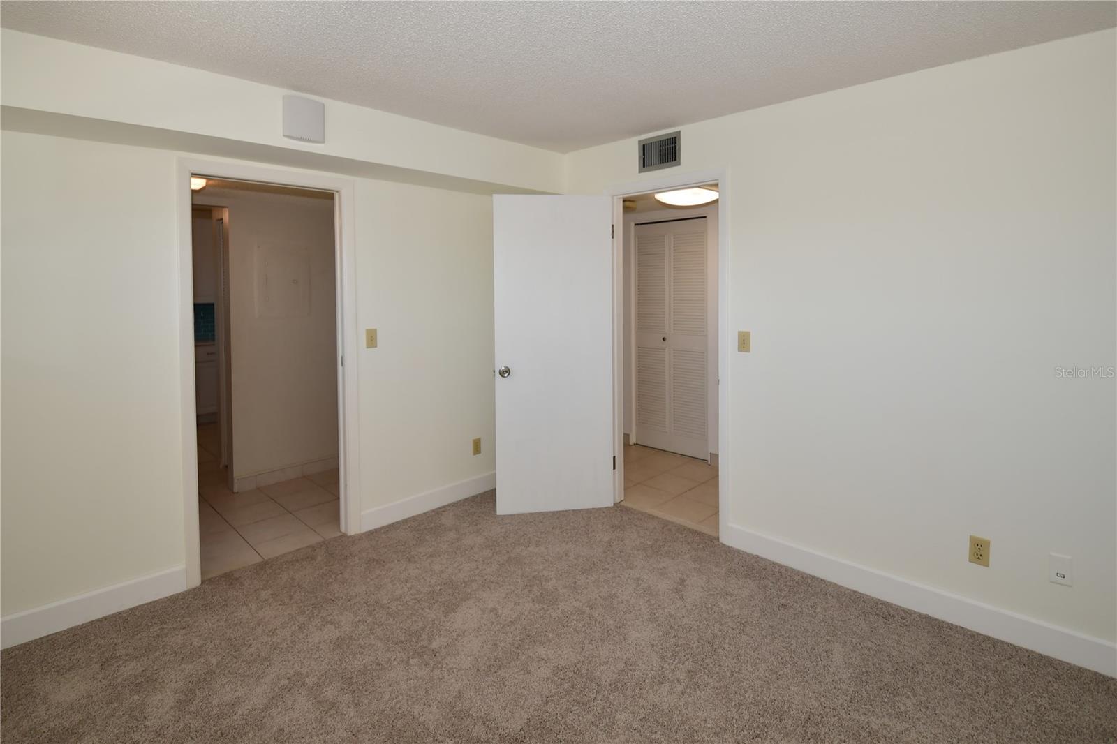 This room has two doors, one off the foyer and another off the hallway leading to the main bath.