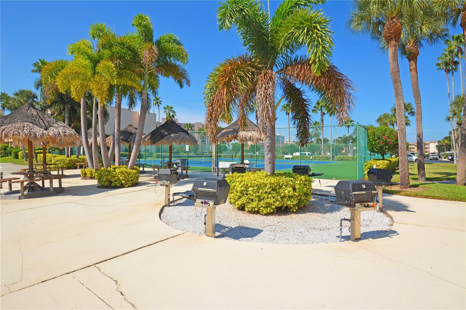 Grills and Tiki hut picnic benches for cook outs.