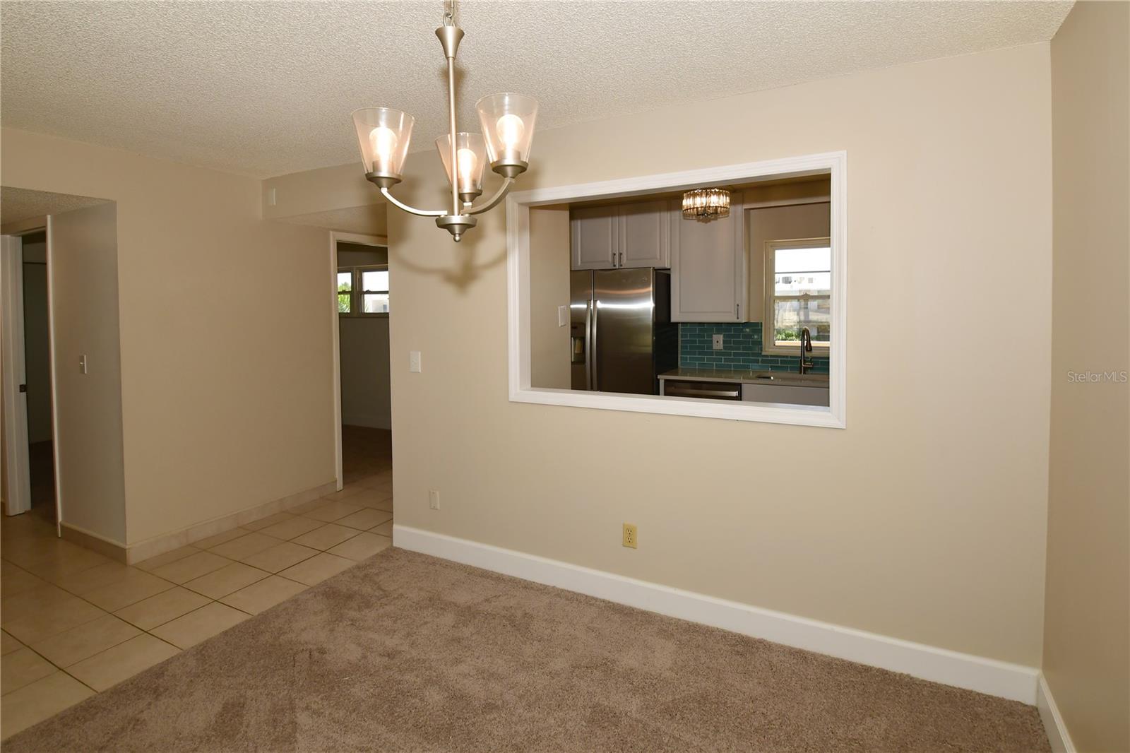 Dining room is off the foyer and the hallway that leads to the main bath and other 2 bedrooms.